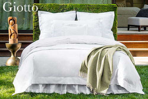 Image of bed made up with Sferra Giotto bed linens