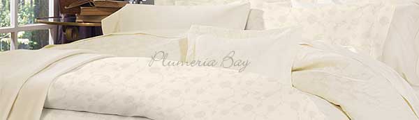 Image of a bed with a duvet, duvet cover and bed linens