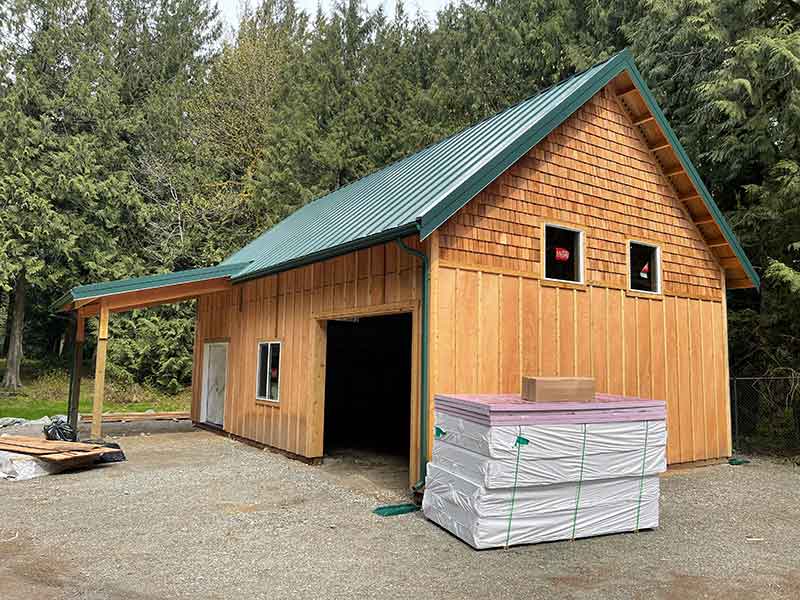 Siding Done, Roof & Rain Gutters Done.  Insulation Waiting To Be Installed on Ground Before Pouring Concrete Floor